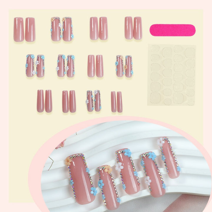 Artificial nail set with delicate flower embellishments and glitter accents Kalsten