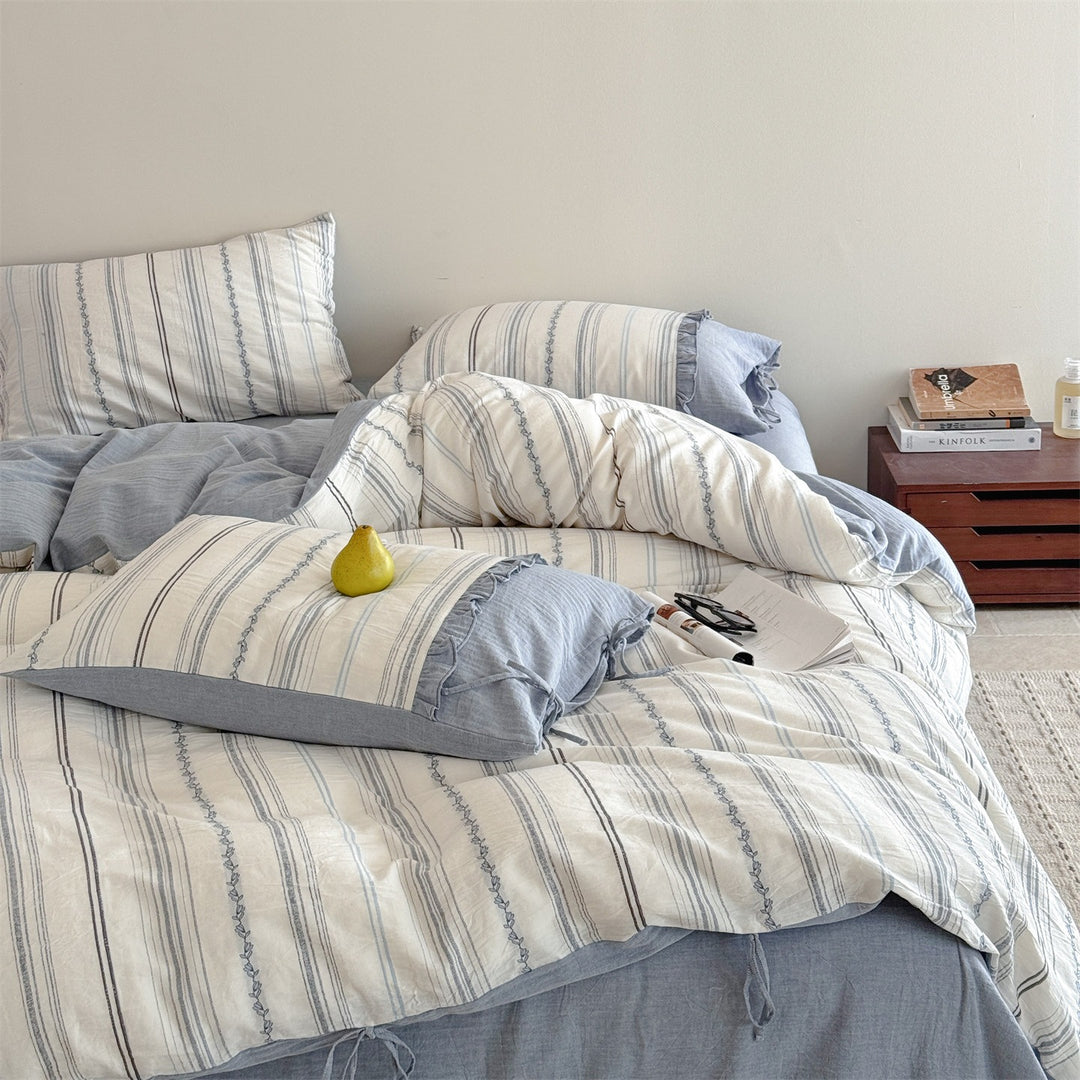 Striped bedding set made of washed linen-cotton mix with fine ribbon embroidery and tie band pillow
