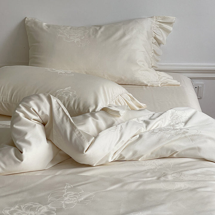 Bedding set made of cotton satin with ruffle, subtle jacquard floral relief and silky-matt finish