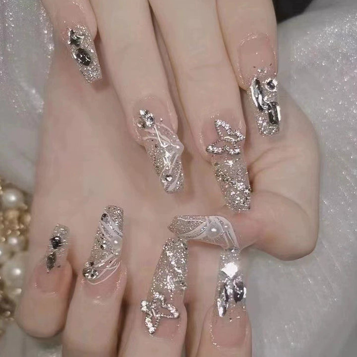Elegant nail design with pearl embellishment Kalsten