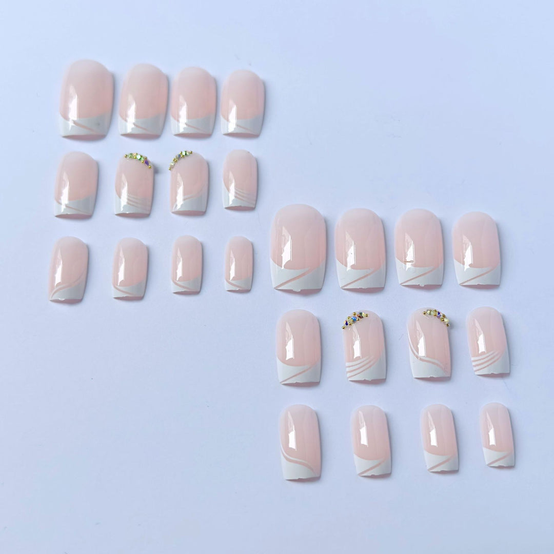 Elegant French Tip Press-On Nails with Gem Accents
