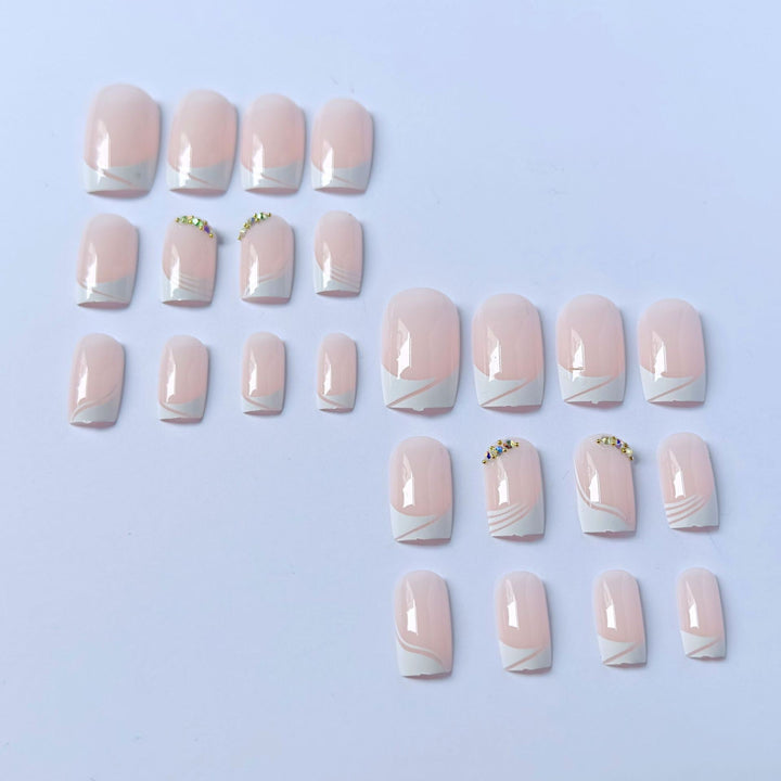 Elegant French Tip Press-On Nails with Gem Accents