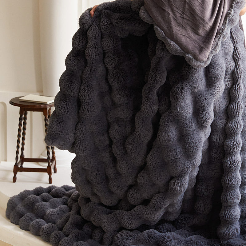 Cozy artificial fur throw blanket with wave structure and extra soft texture