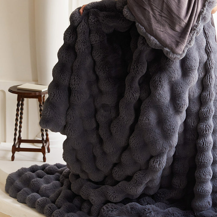 Cozy artificial fur throw blanket with wave structure and extra soft texture
