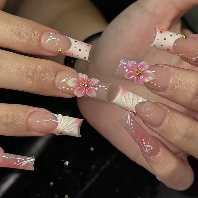 Creative nail art set with floral accents and glitter details Kalsten