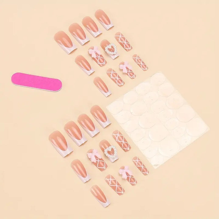 Elegant artificial nail tips with heart and bow accents Kalsten