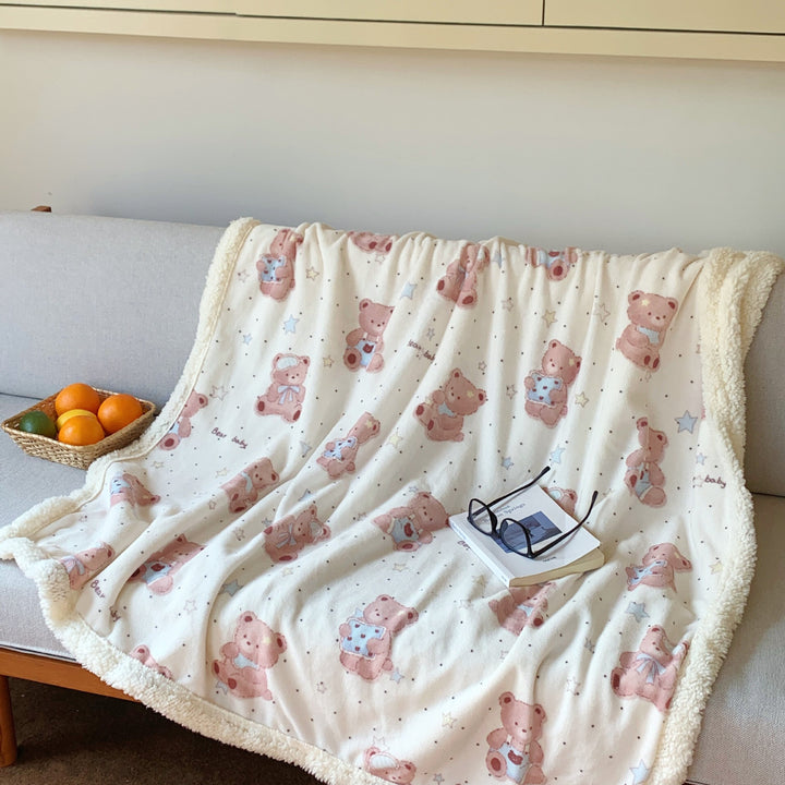 Reversible fleece blanket with cartoon cat design and teddy lining