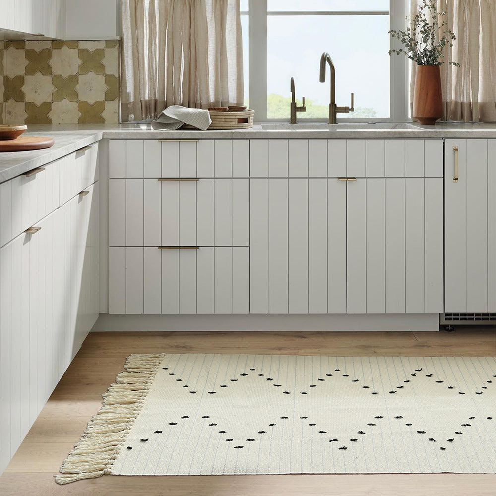 handwoven living room rug with fringes and geometric perforated pattern Kalsten