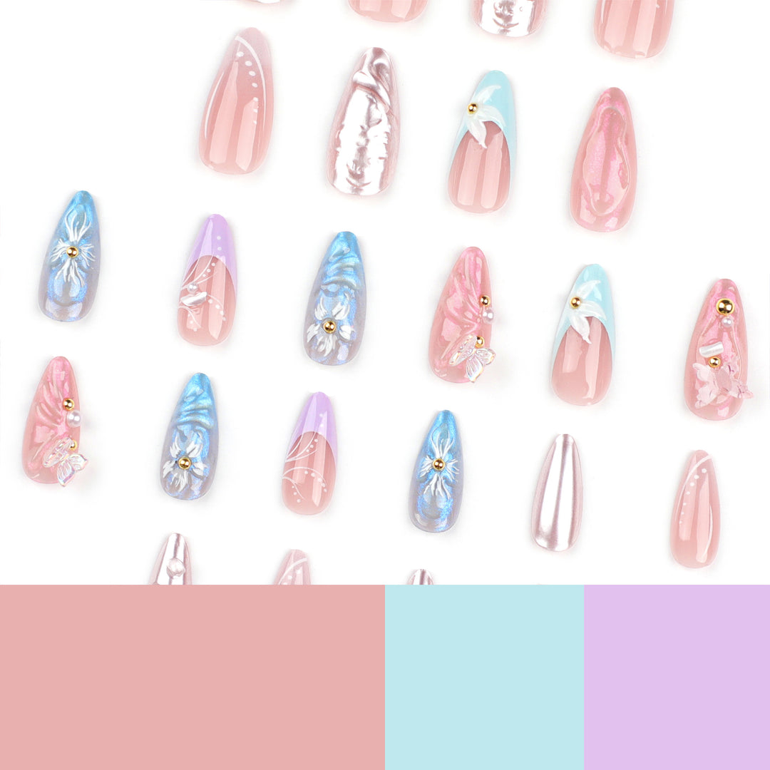 Artistic stiletto nails with delicate flower and glitter embellishments Kalsten