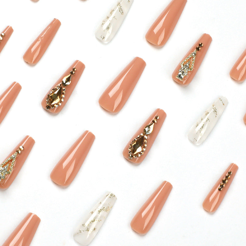 Artful nail extensions with glitter embellishments and delicate accents Kalsten