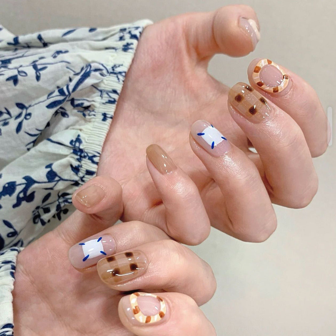 Playful artificial nails with cute animal and pattern accents Kalsten