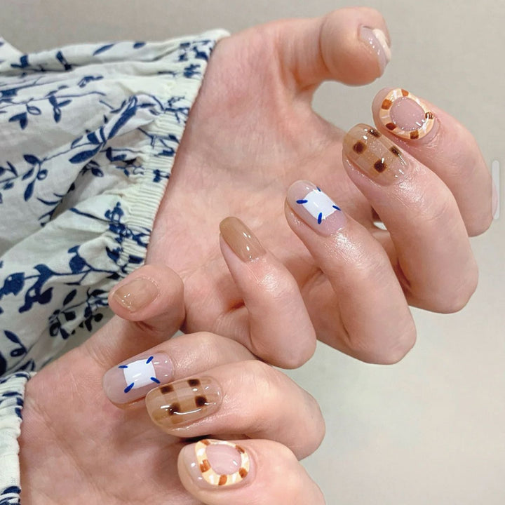 Playful artificial nails with cute animal and pattern accents Kalsten