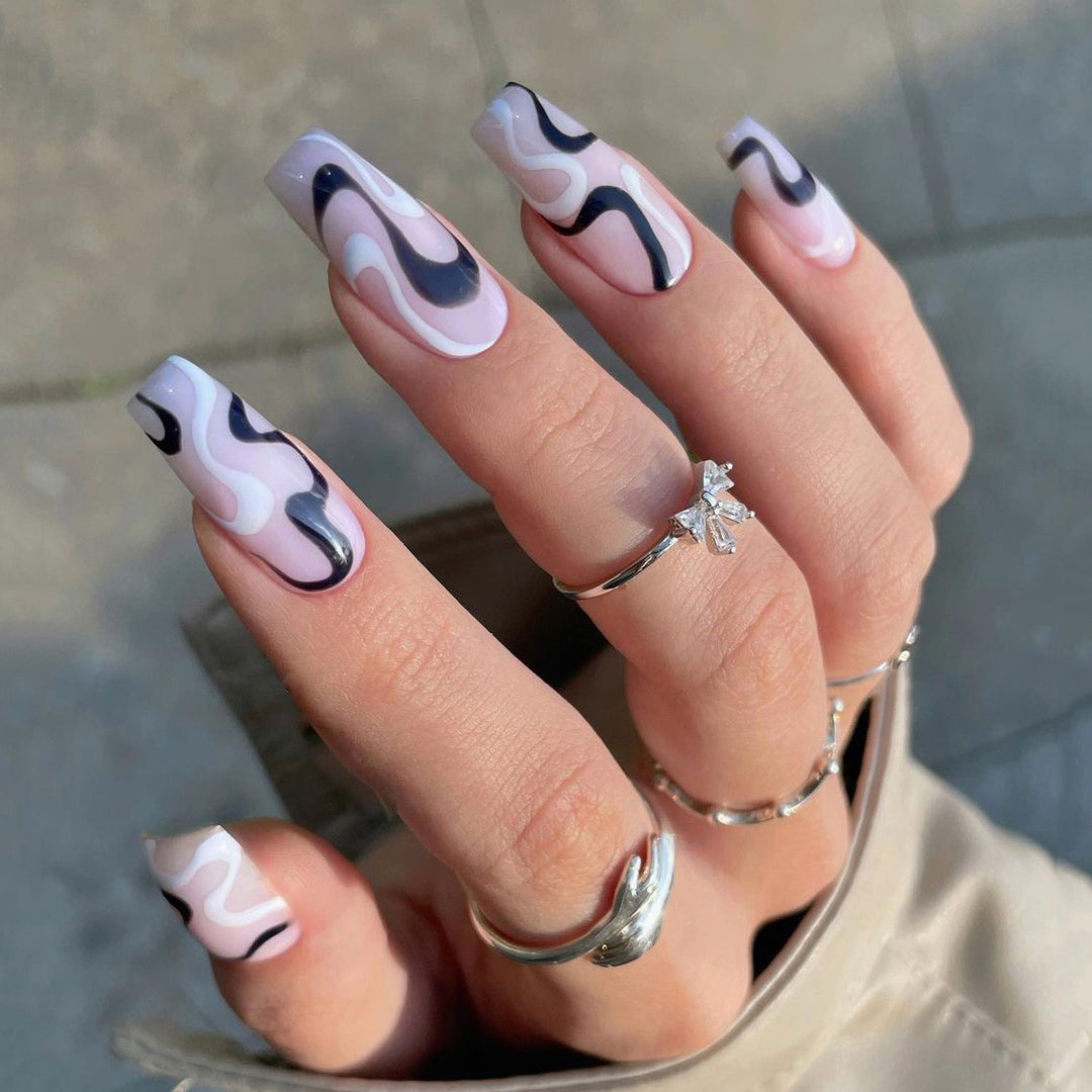 Artful nail extensions with elegant curved patterns Kalsten