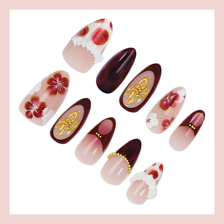 Artificial nail set with luxurious floral designs and glitter accents Kalsten