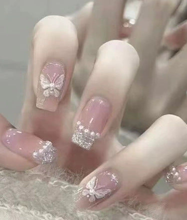 Elegant nail design with pearl embellishment Kalsten