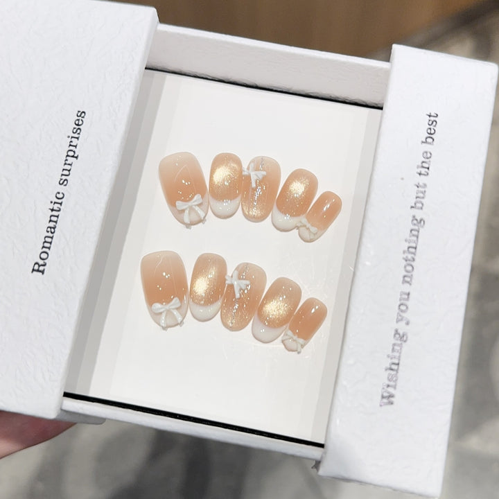 Artificial nails with romantic bow and glitter effects Kalsten