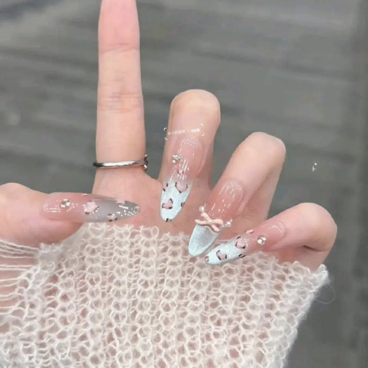 Artistic Press-On Nail Design with Floral and Gemstone Accents Kalsten