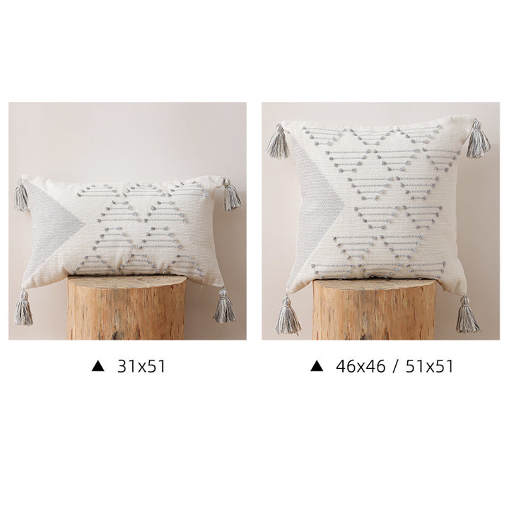Decorative woven cushion cover with geometric tuft-relief and tassels Kalsten
