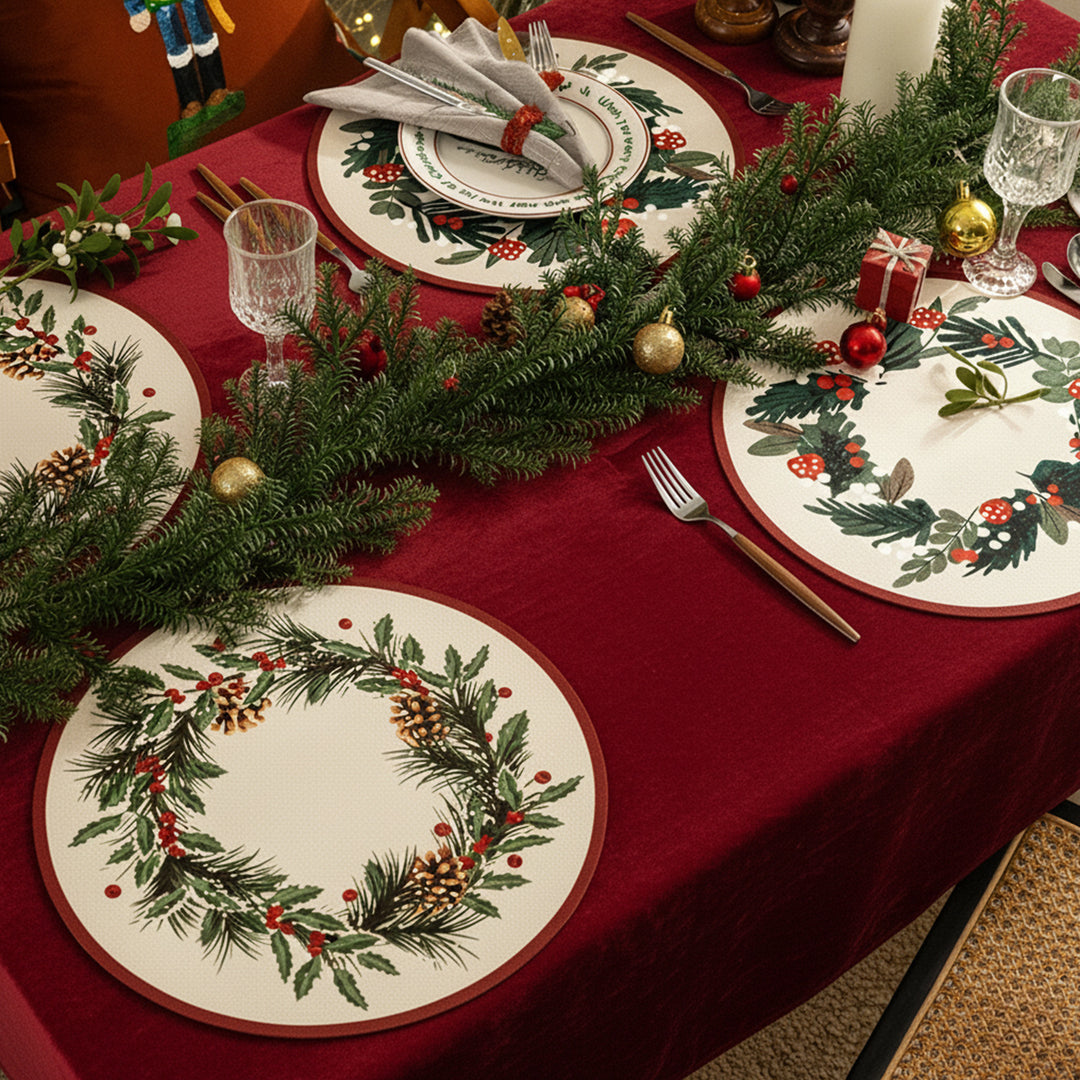 Round wipeable placemat with Christmas pine cone and holly wreath motif Kalsten