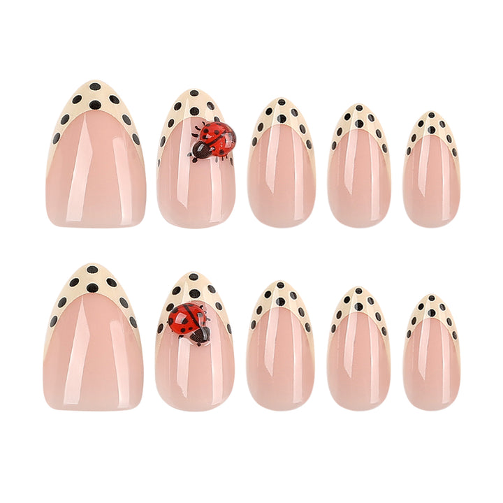 Artful nail art with ladybug motif and polka dots Kalsten