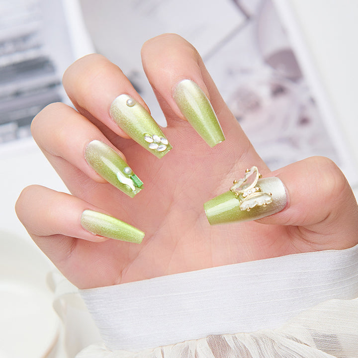Artificial nails with butterfly accents and glitter details Kalsten