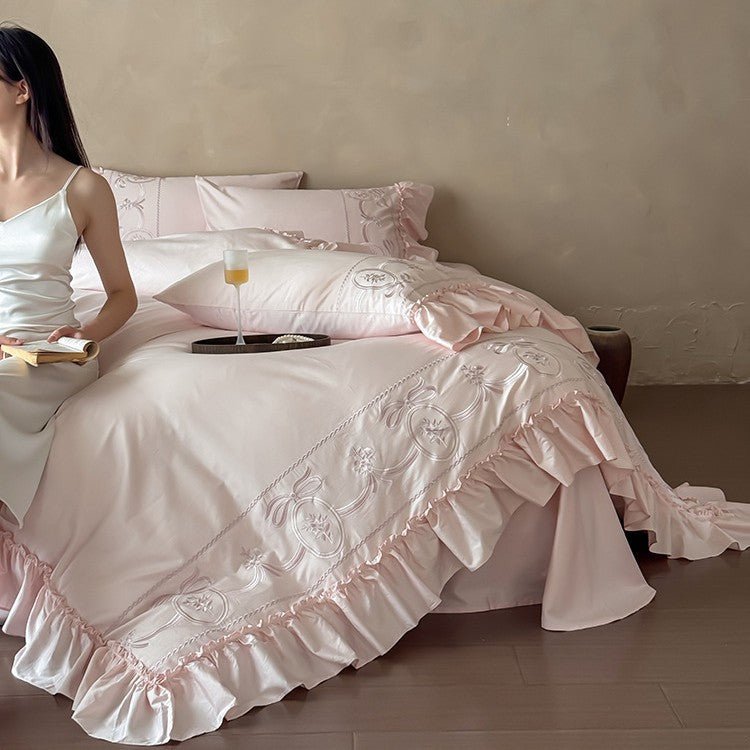Luxurious satin bedding set with ornamental embroidery and gathered hem