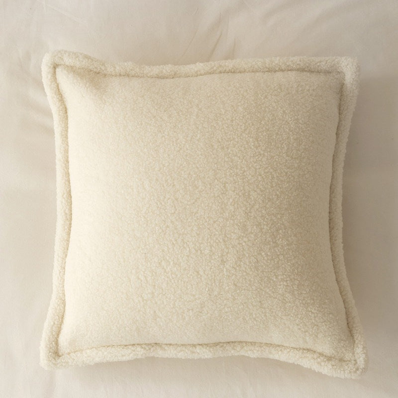 Decorative teddy fleece cushion with padded filling and piped seam