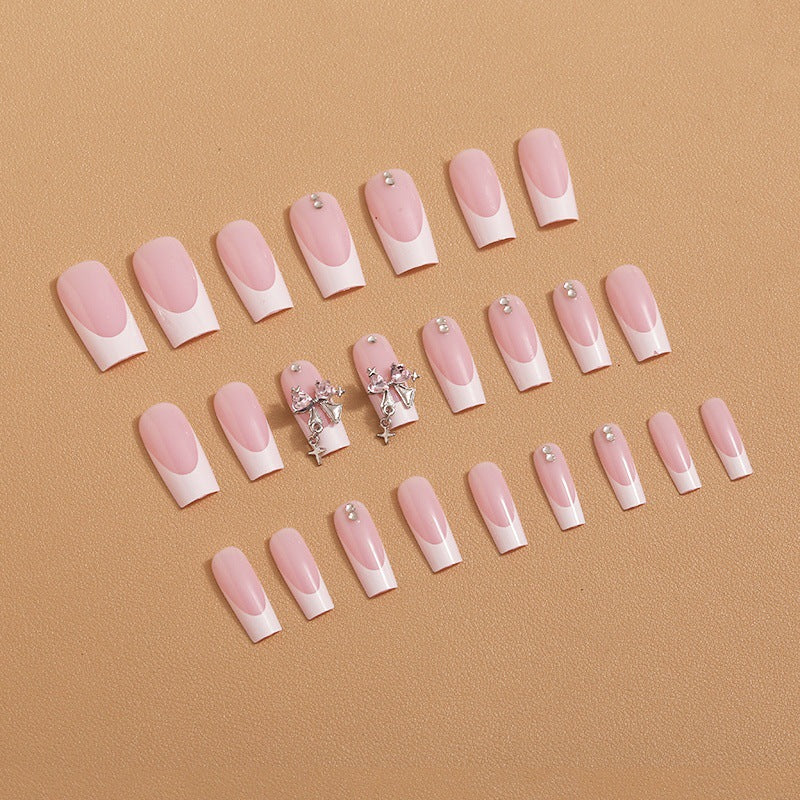 Artificial nail set with luxurious French tips and elegant embellishments Kalsten