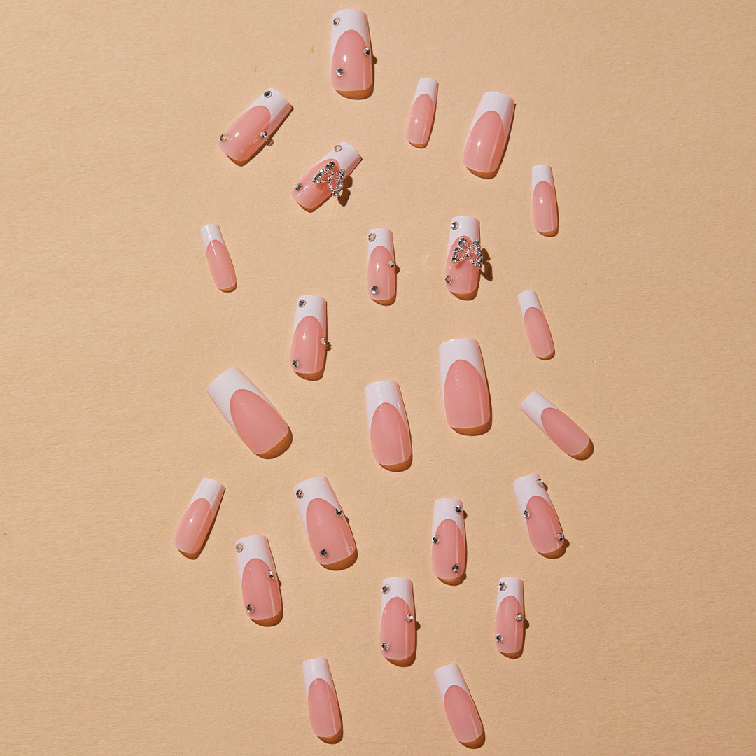 Artificial nails with elegant French tips and glitter accents Kalsten