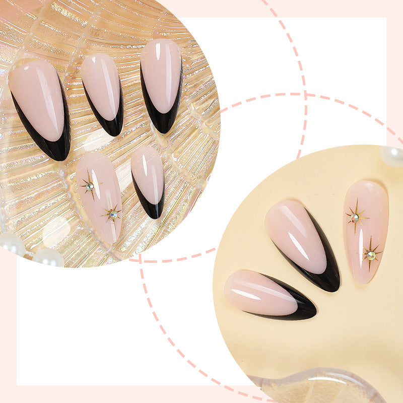 Artificial nail set with elegant black-and-white design and golden star accents Kalsten