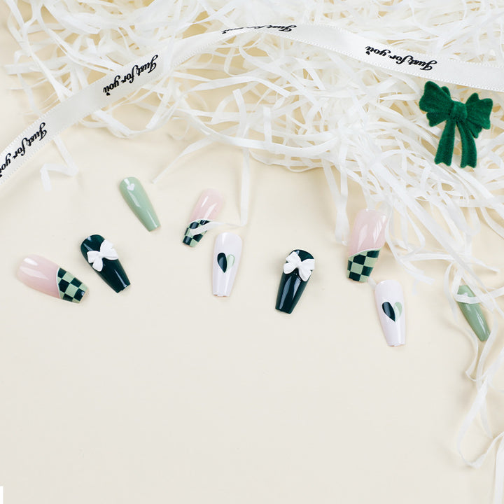 Artificial nail extensions with creative design and glitter accents Kalsten