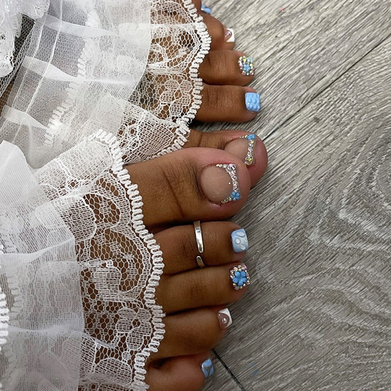 Glamorous artificial nail creation with elegant embellishments Kalsten
