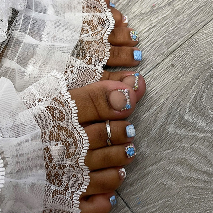 Glamorous artificial nail creation with elegant embellishments Kalsten