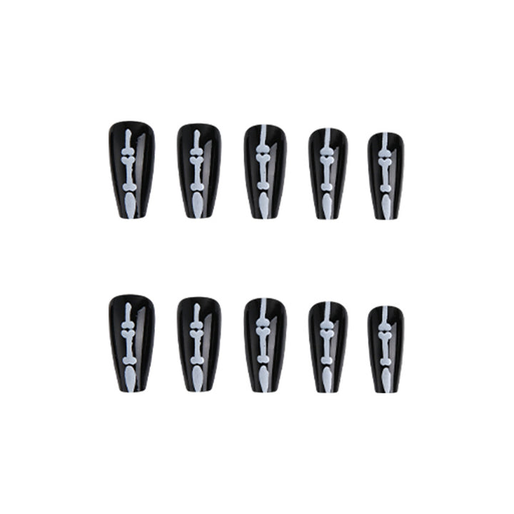 Artistic nail art with skull and bone motif Kalsten