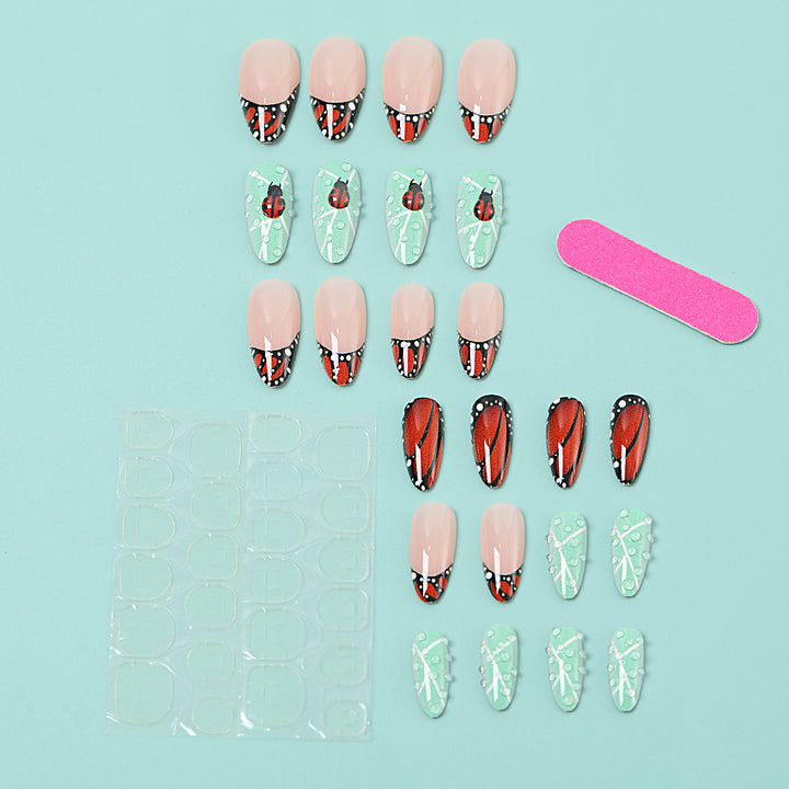 Creative nail art with elaborate butterfly and flower designs Kalsten