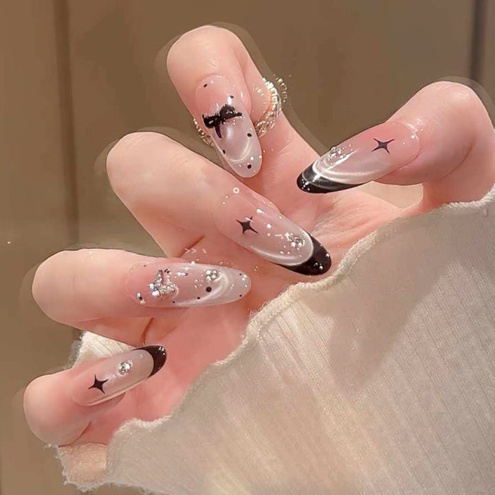 Artificial nail set with festive gift design and elegant glitter accents Kalsten