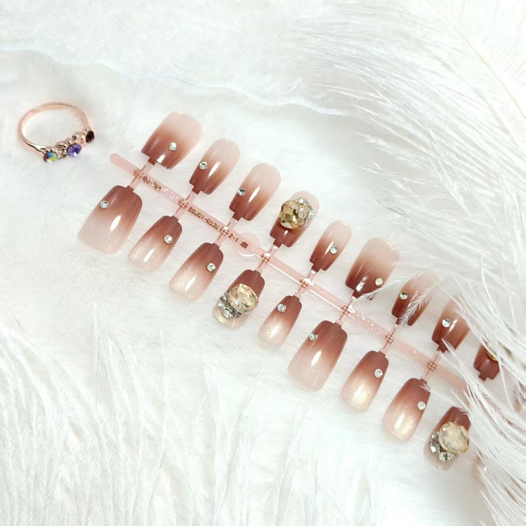 Artificials nails in elegant ombre style with rhinestone embellished applications Kalsten