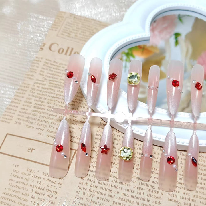 Glamorous artificial nails with shimmering embellishments Kalsten