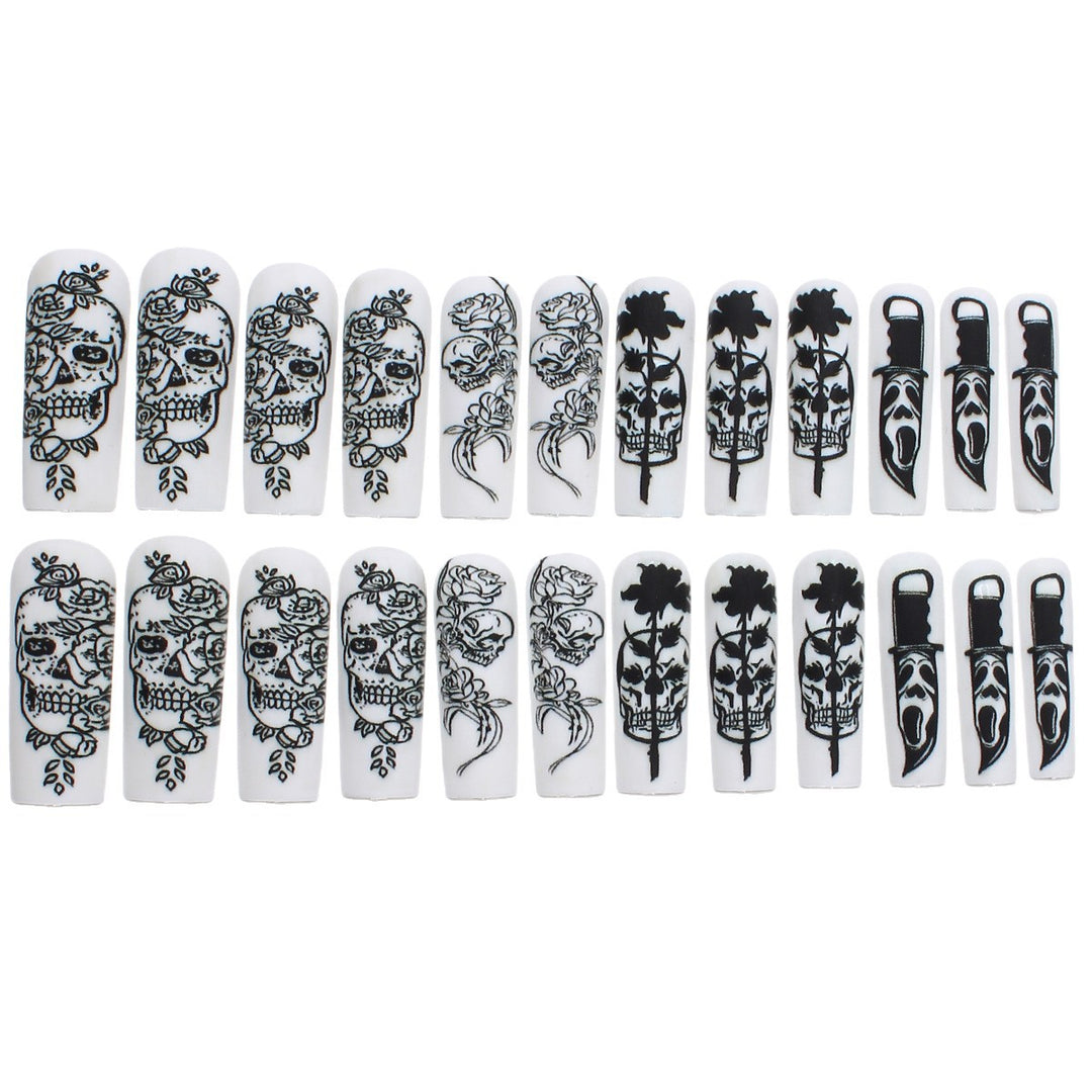 Nail set with spooky skull design and floral motifs Kalsten
