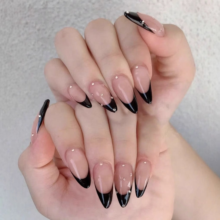 Artificial nail tips with elegant French design and glamorous details Kalsten
