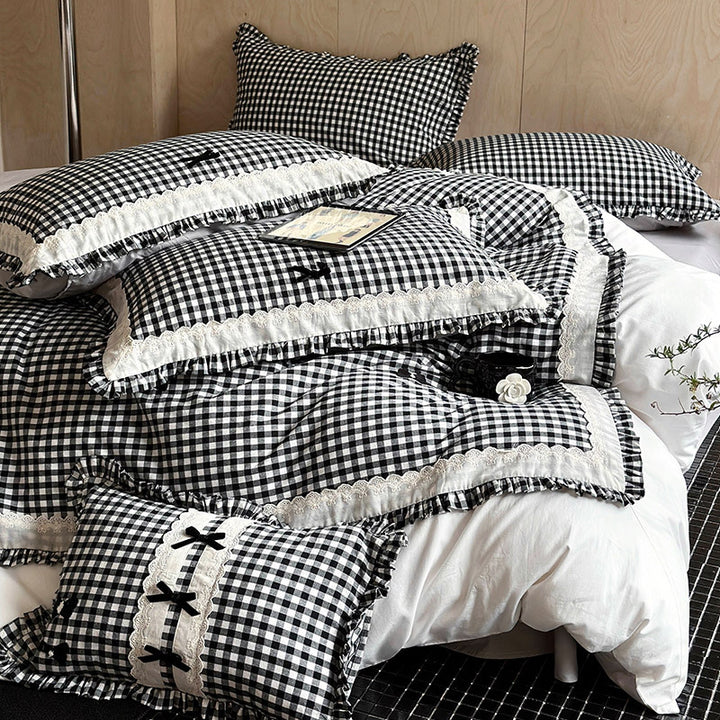 Bedding set in country house style with Vichy check, ruffle and embroidery appliqués