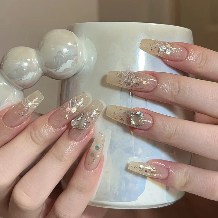 Elegant nail extensions with glitter and flower design Kalsten