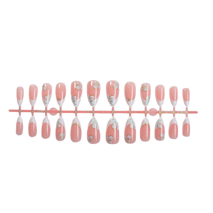 Artificial nail set with elegant flower and French tip design Kalsten
