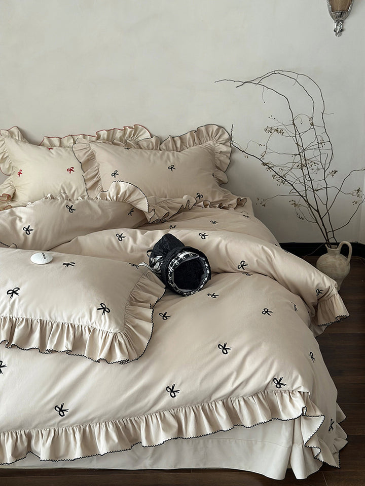 Luxurious bed linen set with ruffles and embroidered bows