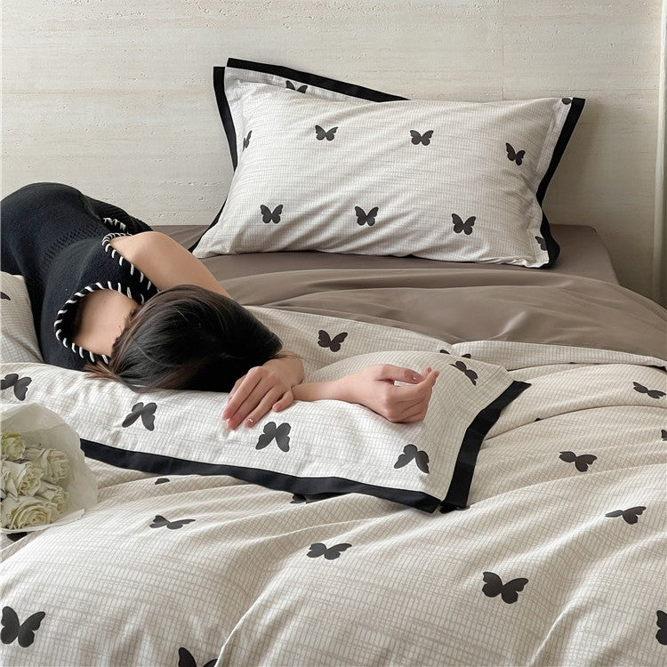 Luxurious cotton satin bedding set with butterfly motif and contrasting frame edge