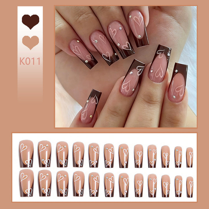 Elegant artificial nails with heart pattern and glitter accents Kalsten