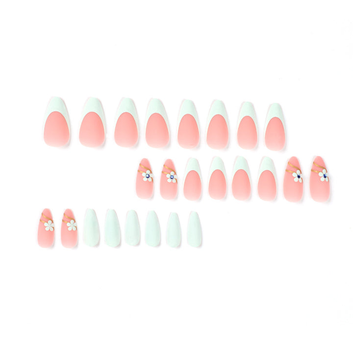 Artistic stiletto nails with floral accents and glitter embellishments Kalsten