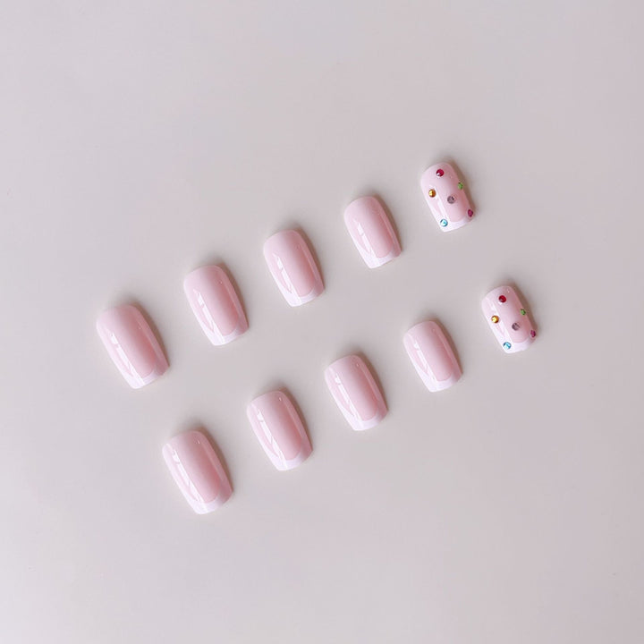 Nail art set with elegant French tips and sparkling rhinestone embellishments Kalsten