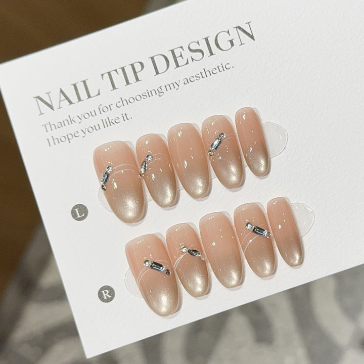 Artificial nail tips with elegant gradient color and rhinestone accents Kalsten