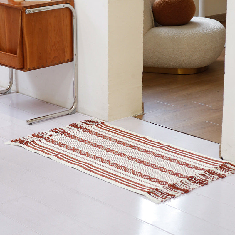 Flat-woven cotton runner with fringes and graphic ethnic stripe pattern Kalsten